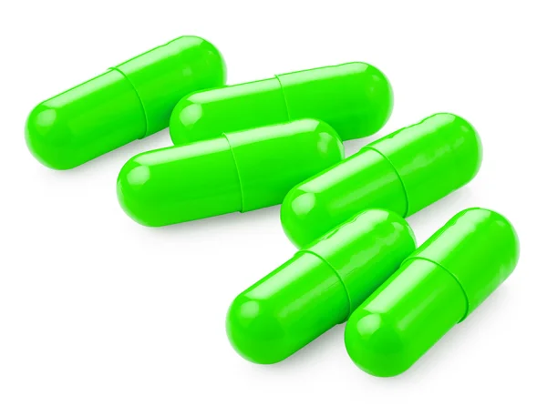 Pílulas verdes em branco — Fotografia de Stock