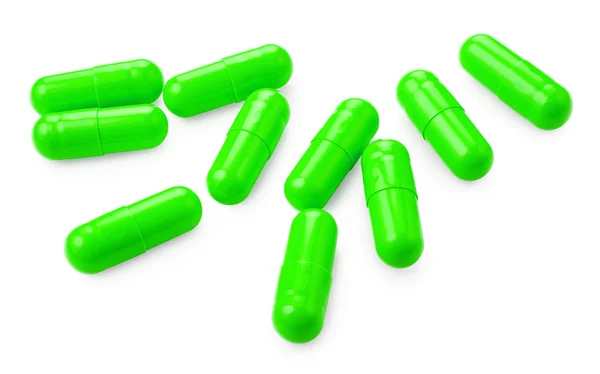 Pílulas verdes em branco — Fotografia de Stock