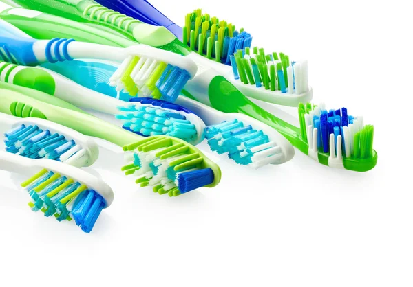 Синие и зеленые зубные щетки — стоковое фото