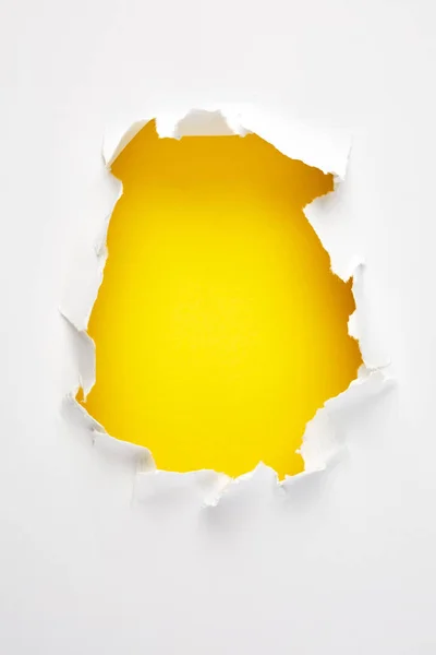 Yellow hole in paper — Stock Photo, Image