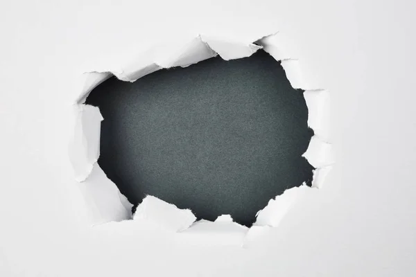 grey hole in paper