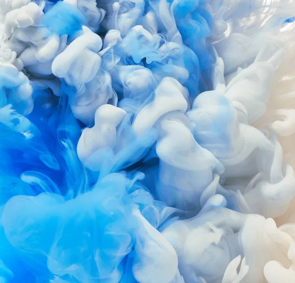 Paint splashes in water — Stock Photo, Image