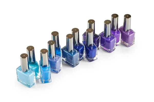 Frascos de verniz de unhas azul e roxo — Fotografia de Stock