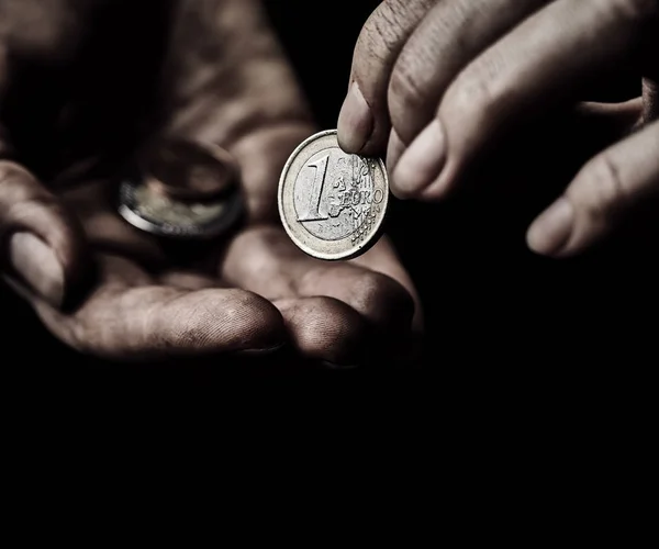 Beggar hands with coins — Stock Photo, Image