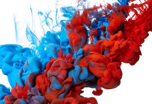 Kleurrijke inkt druppels in water — Stockfoto