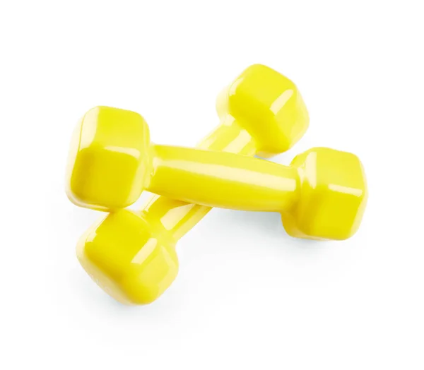 Yellow dumbbells on white — Stock Photo, Image