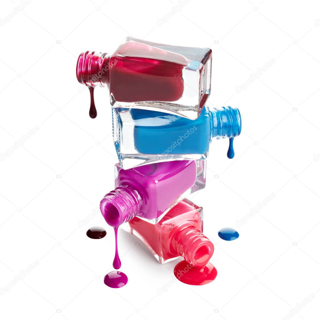 Nail polish dripping from stacked bottles