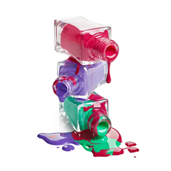 Stack of bottles with spilled nail polish — Stock Photo, Image