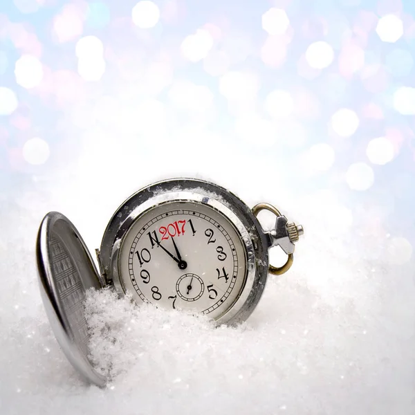 Watch lying in the snow Stock Image