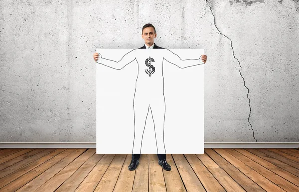 Zakenman die grote witte poster met getekende silhouet en dollar teken op zijn borst — Stockfoto