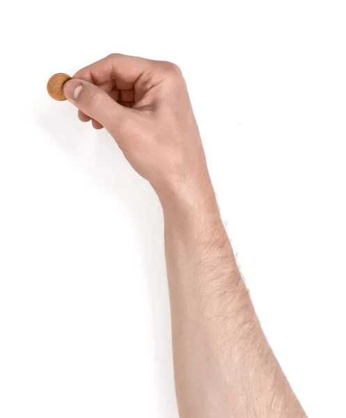Nahaufnahme einer Hand, die eine Münze hält — Stockfoto
