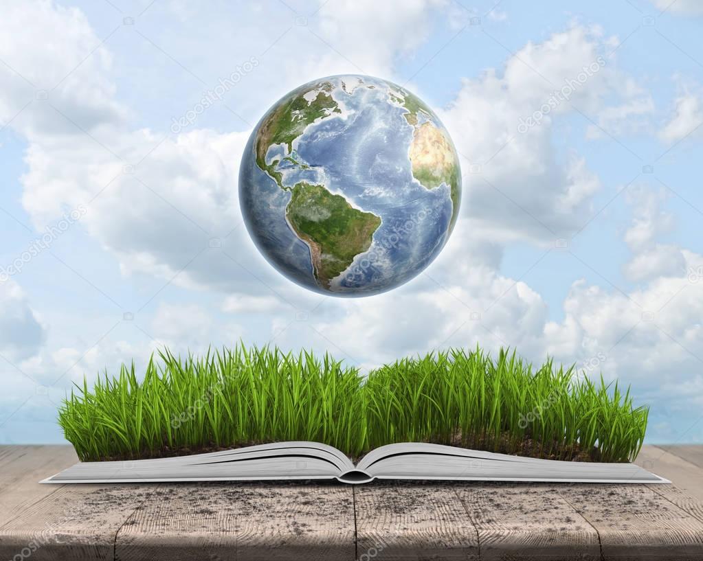 Green landscape covered by grass on an open book with Globe.