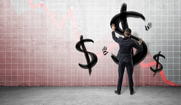 Бізнесмени на статистичному графіку розміщують руки на стіні з чорними пофарбованими знаками долара і відбитками рук . — стокове фото