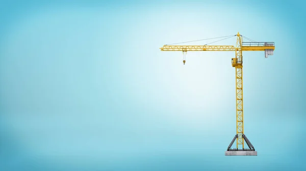 A yellow stationary tower crane without any load in full length on blue background. — Stock Photo, Image