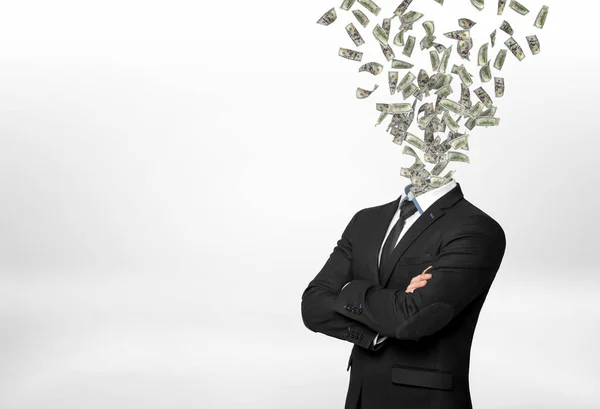 Een zakenman met forded handen en vele dollarbiljetten vliegen in plaats van zijn hoofd. — Stockfoto
