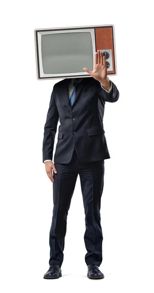 Ένας επιχειρηματίας κάνει ένα stop motion με την παλάμη του, ενώ φοράει ένα vintage κουτί τηλεόραση στο κεφάλι του. — Φωτογραφία Αρχείου