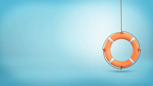 3d rendering of a single orange life buoy hangs down from a rope on a blue background. — Stock Photo, Image