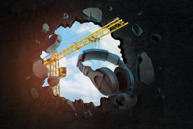 Üç boyutlu vinç tasarımı siyah kulaklık taşıyor ve mavi gökyüzü ile siyah duvarda delik açıyor..