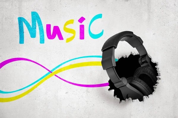 3d rendering of black headphones breaking white wall with colorful MUSIC sign — Stock Photo, Image