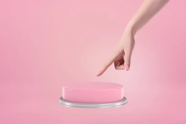 Sidovy av kvinnors hand redo att trycka på en stor rosa knapp på rosa bakgrund. — Stockfoto