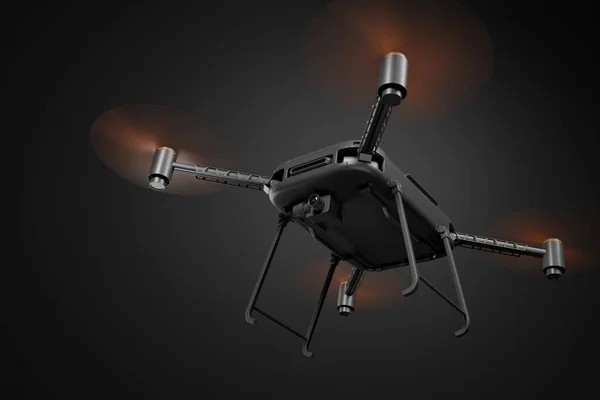 3D渲染黑色无人机，带有橙色螺旋桨和黑色摄像机，从下方观看，在深灰色渐变背景下飞行. — 图库照片