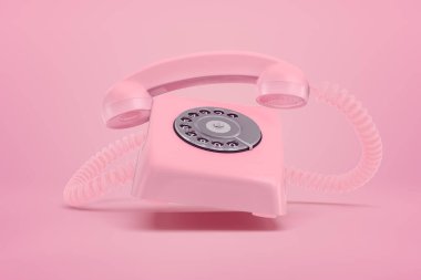 Pembe arka planda pembe retro telefonun 3D görüntüsü