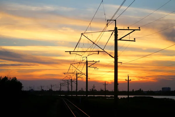 Photo bright sunset over the railway — Stock Photo, Image