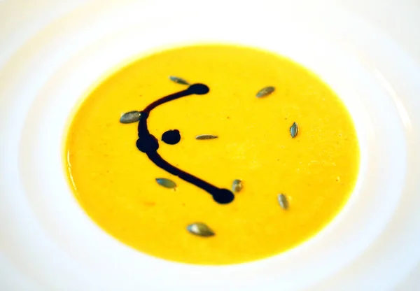 Photo macro yellow pumpkin soup — Stock Photo, Image