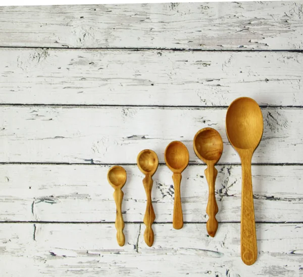 Wooden kitchen spoon on the table, top view — Stock Photo, Image