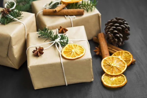 Christmas retro wrapped gifts with dried orange slice and fir tr — Stock Photo, Image