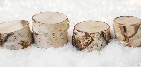 Christmas decorations made of birch wood in the snow with backgr — Stock Photo, Image