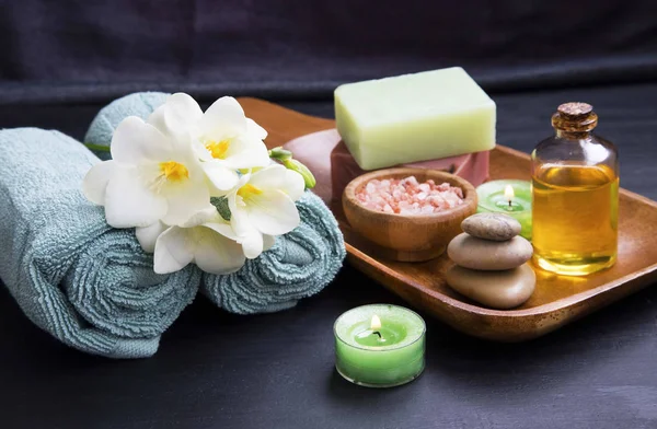 Spa set treatments products with flower, towels, oil salt , soap — Stock Photo, Image