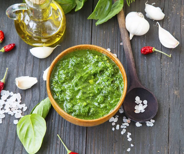 Pesto sauce in a bowl with basil, olive oil and spices — Stock Photo, Image