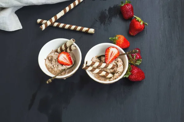 Chocolate sorbet with strawberry fruits desserts in cups, summer