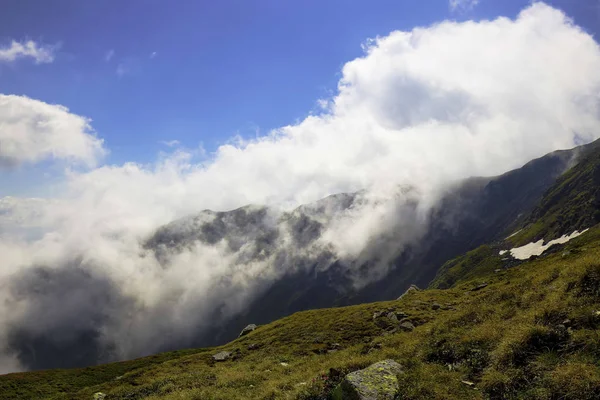 Clouds in the mountains landcape