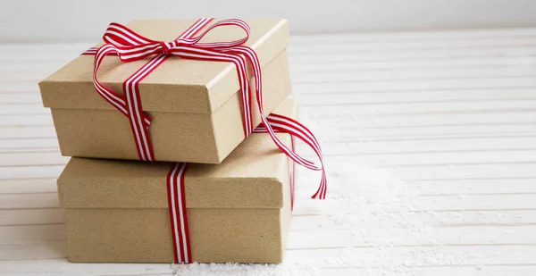 Christmas presents with red and white ribbon — Stock Photo, Image