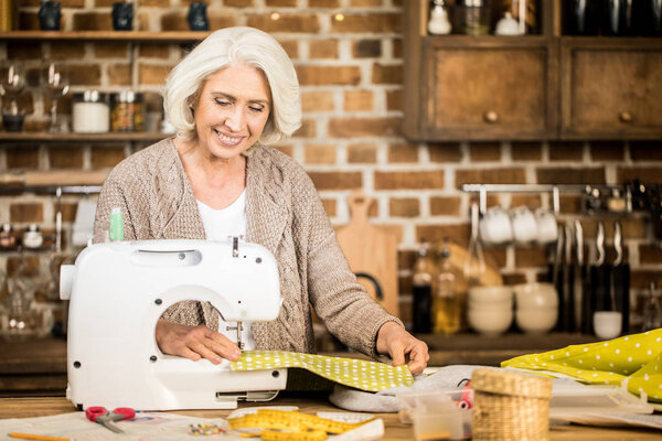 Woman using sewing machine 