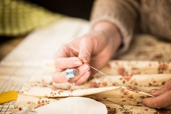 Woman sewing cloth   