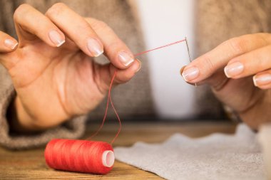 Needle with red thread