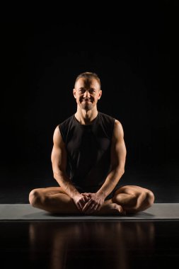 Man sitting in lotus position clipart