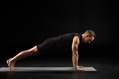 Man standing in yoga position clipart