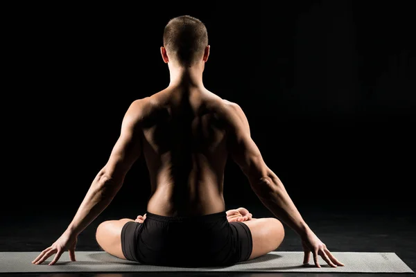 Man sitting in lotus position — Stock Photo, Image