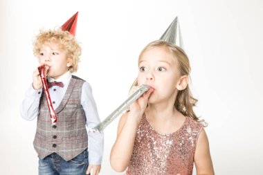 Kids with party blowers clipart