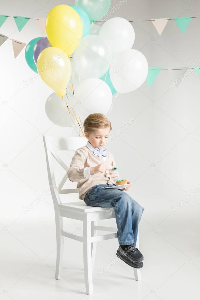 Boy eating festive dessert 