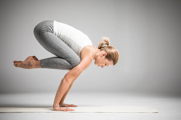 Woman standing in yoga position 