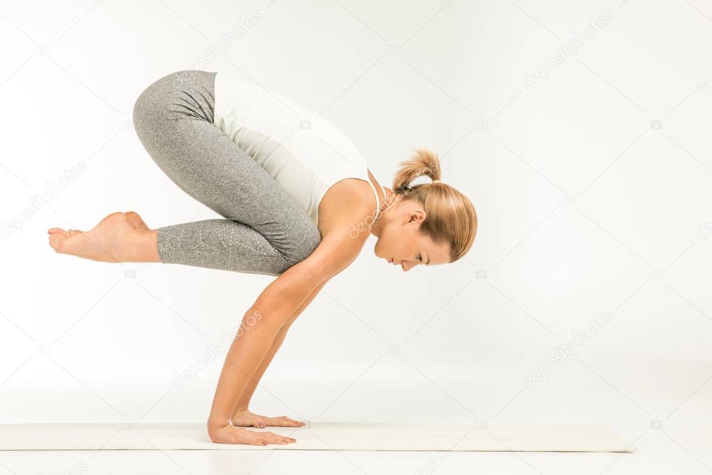 Woman standing in yoga position