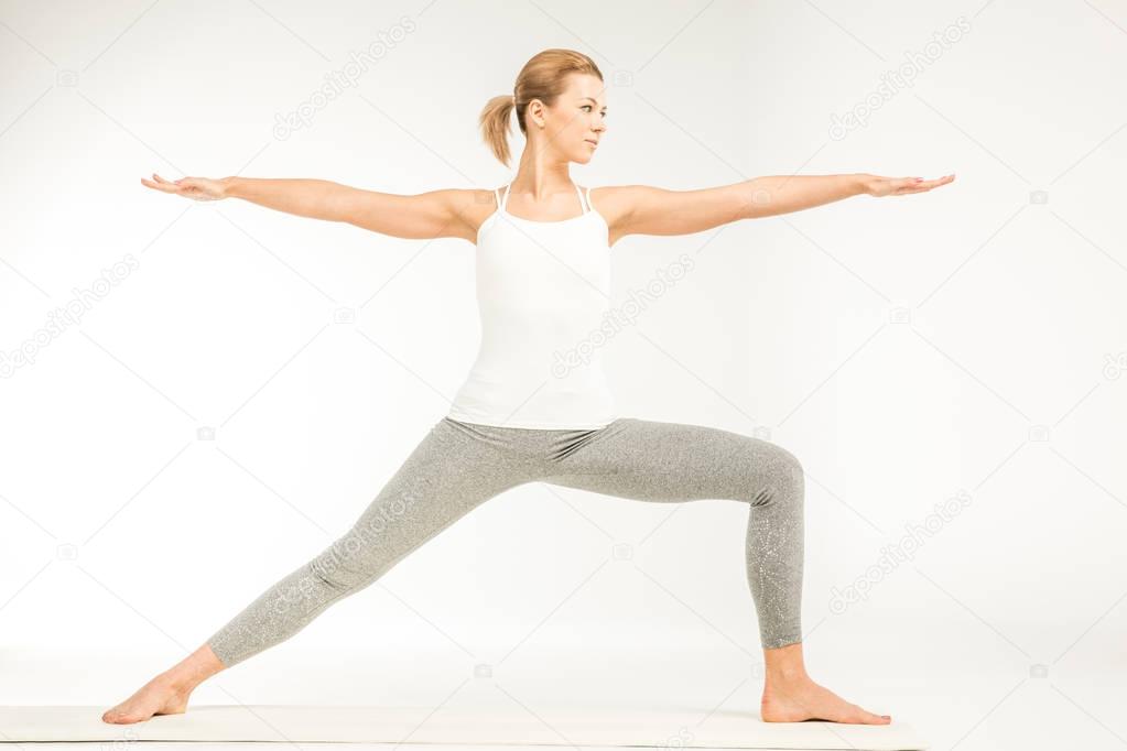 Woman standing in yoga position