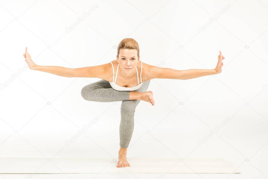 Woman standing in yoga position