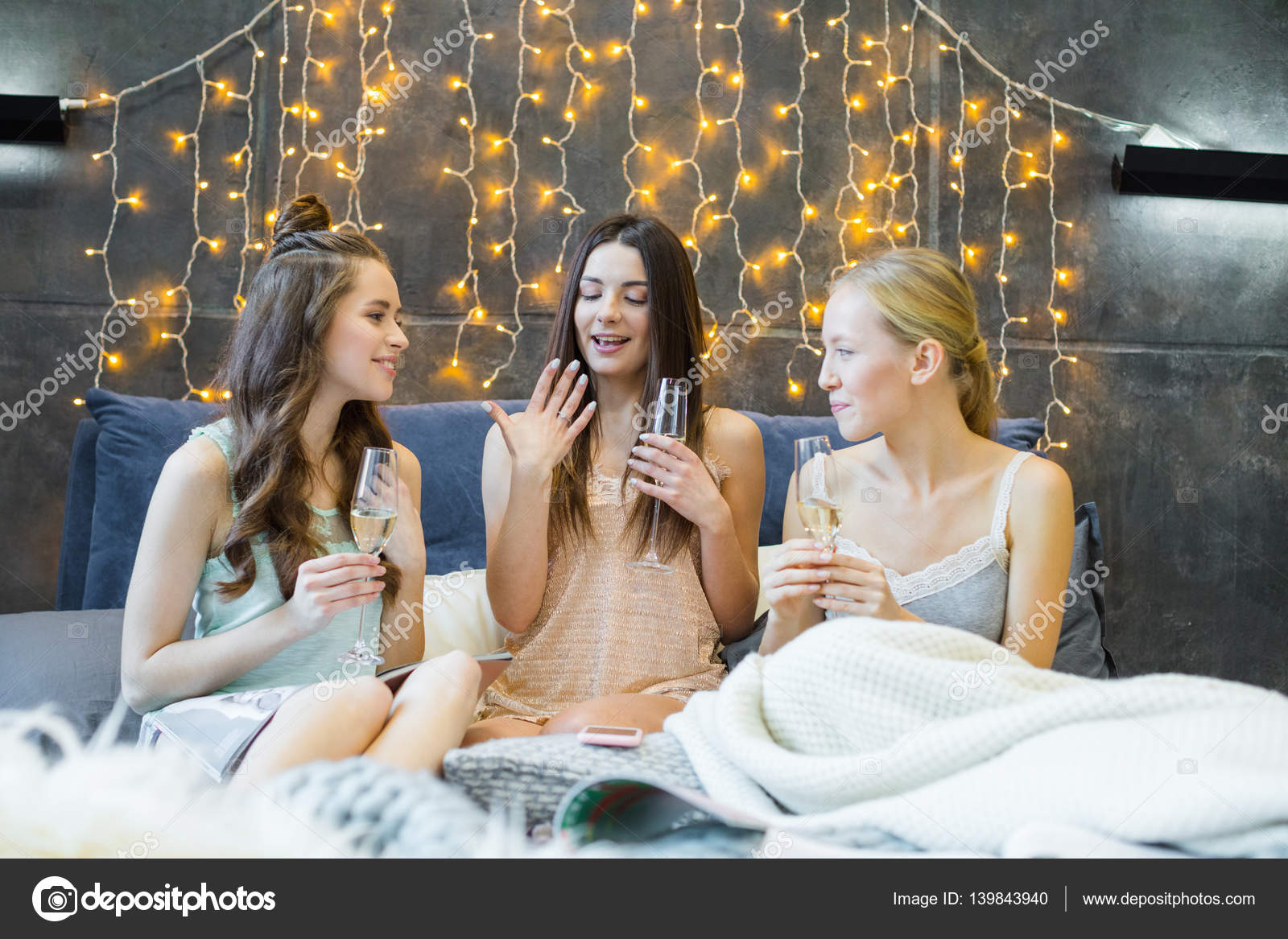Young women drinking champagne ??? Stock Photo ?? OlgaZakrevskaya 139843940