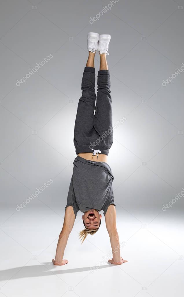 Man performing handstand